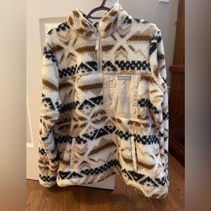 I am selling a Columbia furry sweater, it is white, brown and black.